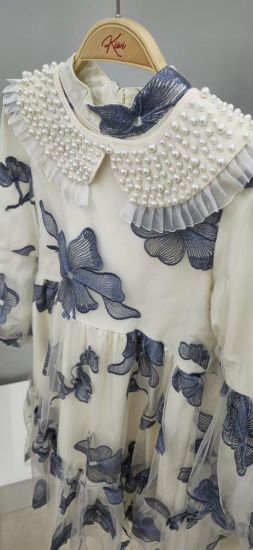 صورة فستان بيج تل بربطة العنق المزينه بالؤلؤ